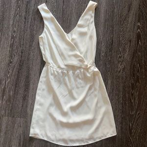 Mini white flowy dress with folded neck detail